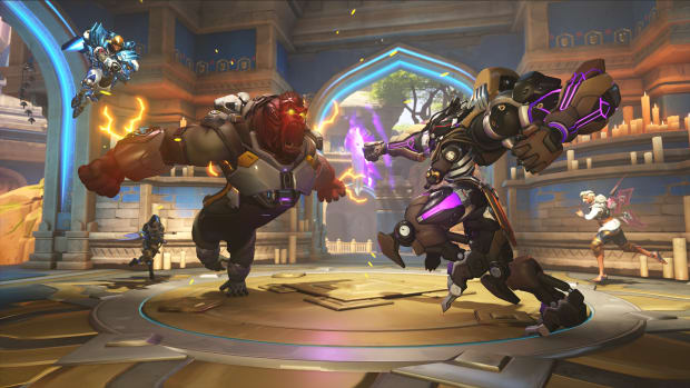 A giant gorilla and a giant robot face off in the middle of a stone room
